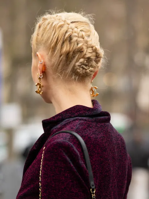The supplied hairstyle reference: a blonde braided updo